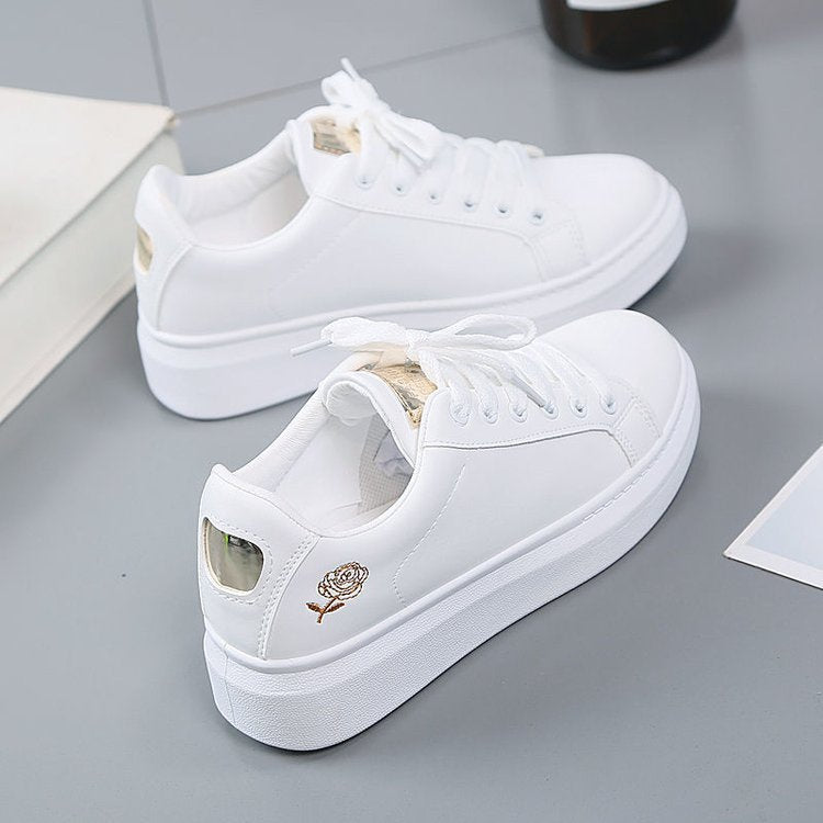 Simple rose embroidered white sneakers for women, flat and casual.