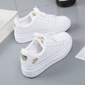 Simple rose embroidered white sneakers for women, flat and casual.