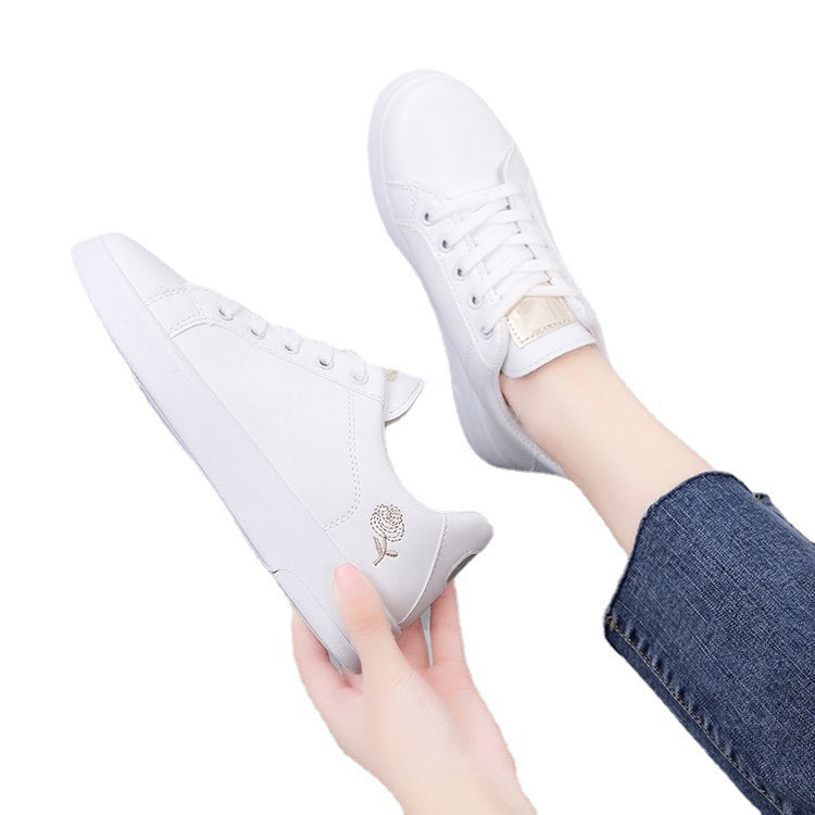 Simple rose embroidered white sneakers for women, flat and casual.