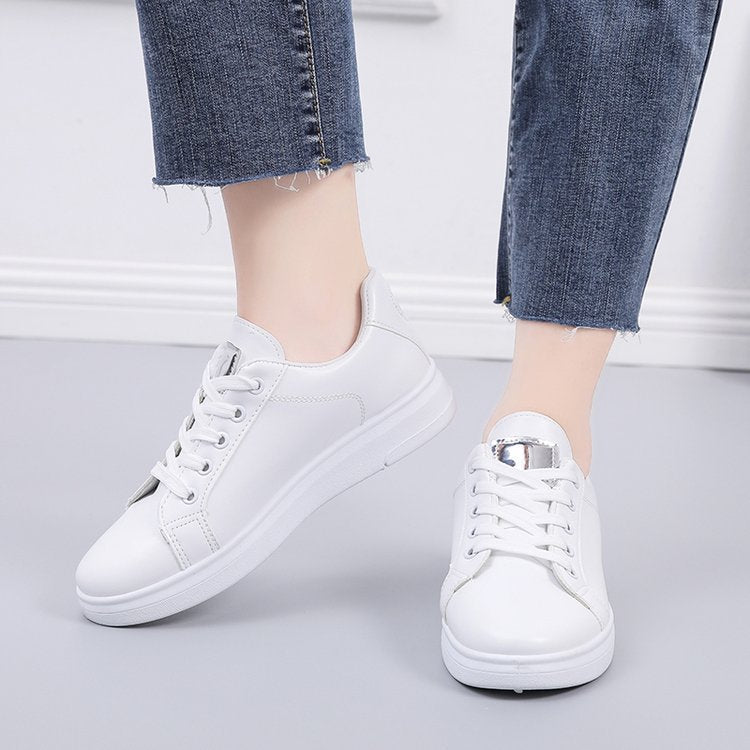 Simple rose embroidered white sneakers for women, flat and casual.