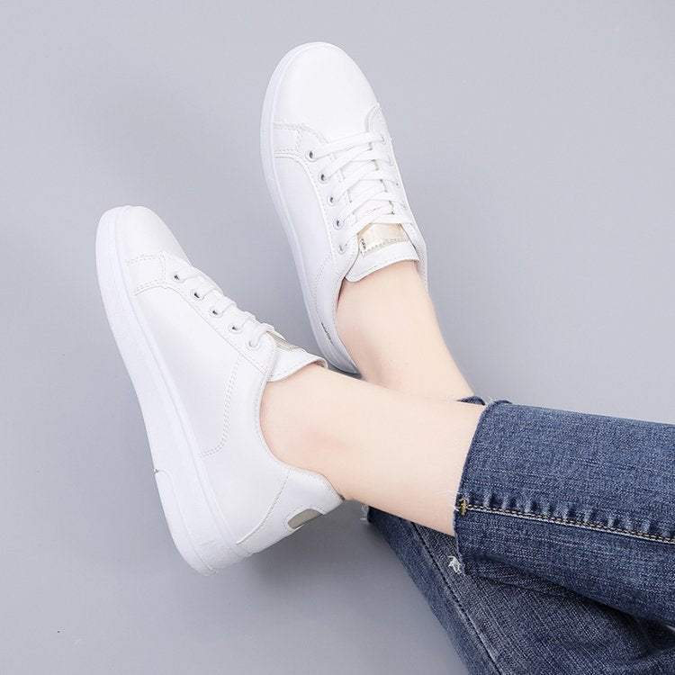 Simple rose embroidered white sneakers for women, flat and casual.