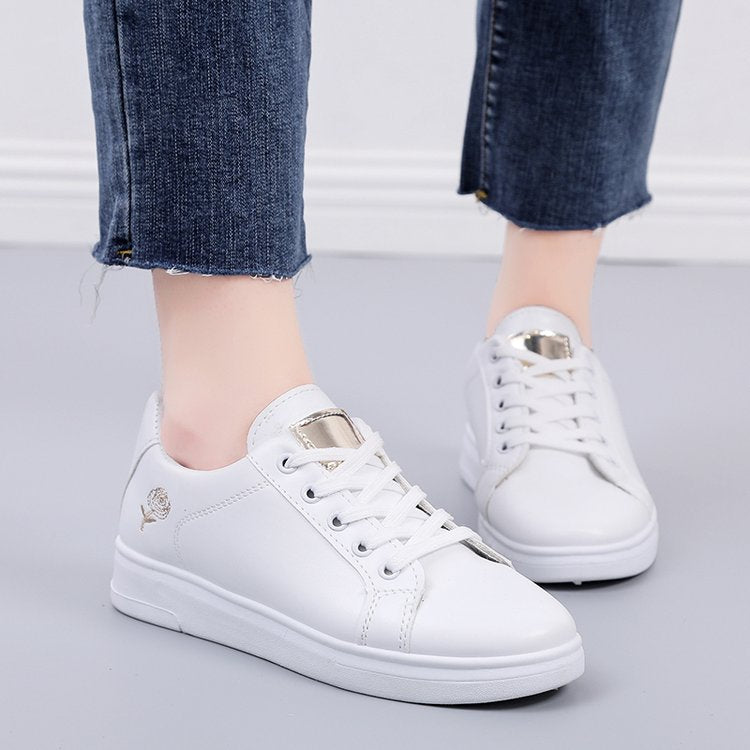 Simple rose embroidered white sneakers for women, flat and casual.
