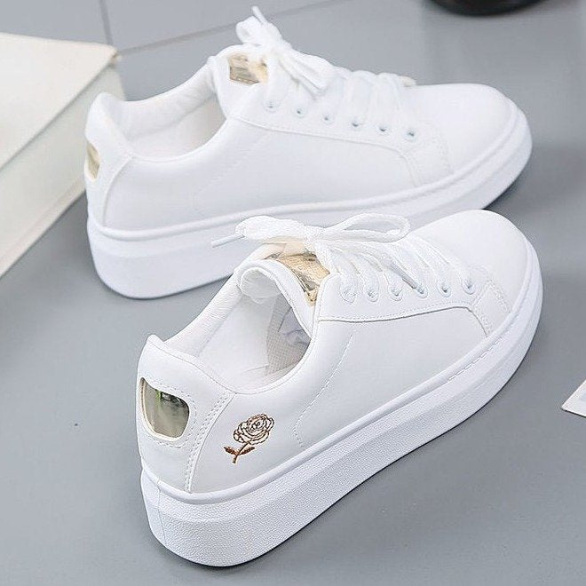 Simple rose embroidered white sneakers for women, flat and casual.